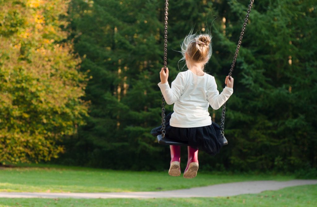 Child on a swing.