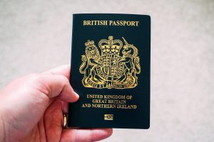 Man holding the new British Passport