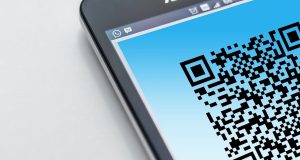Mobile phone scanning a QR Code