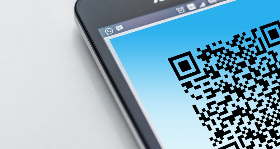 Mobile phone scanning a QR Code